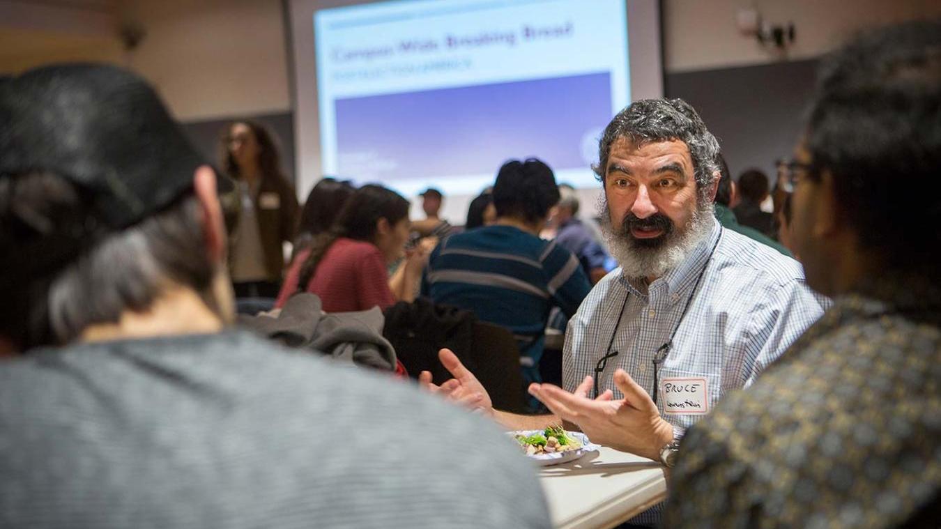 Professor Bruce Lewenstein at an event with students